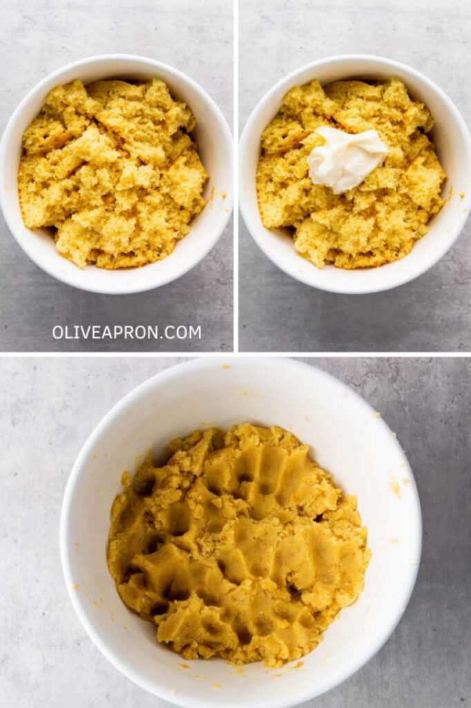 Crumbled yellow cake mixed with frosting in a white bowl to form smooth cake pop dough.