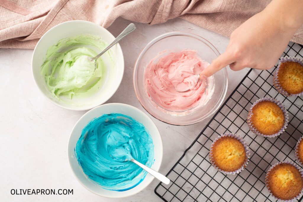 Pastel icing cupcake in bowls