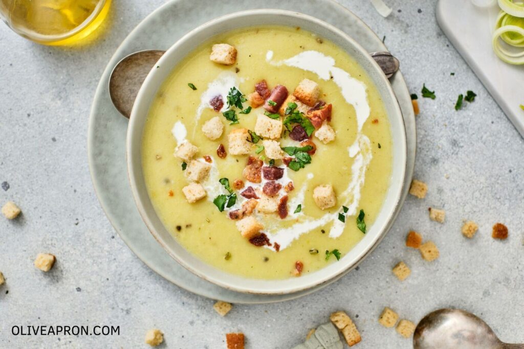 Potato leek soup with bacon and croutons served in a bowl