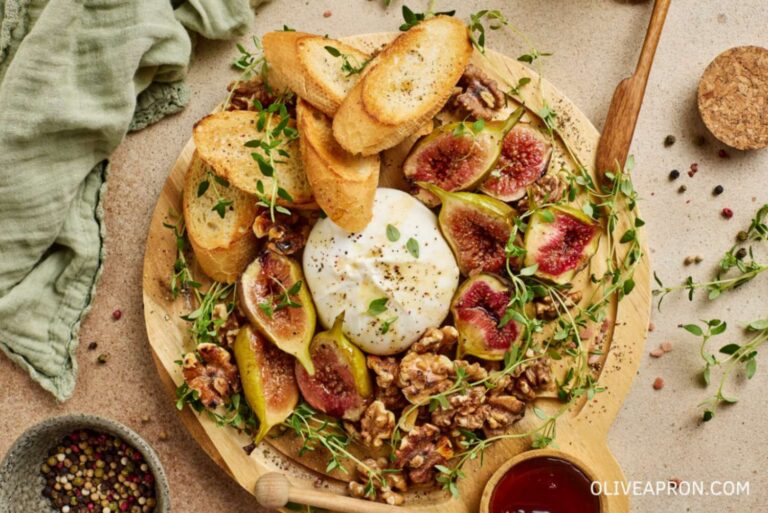 Burrata mezze ingredients on a wooden board