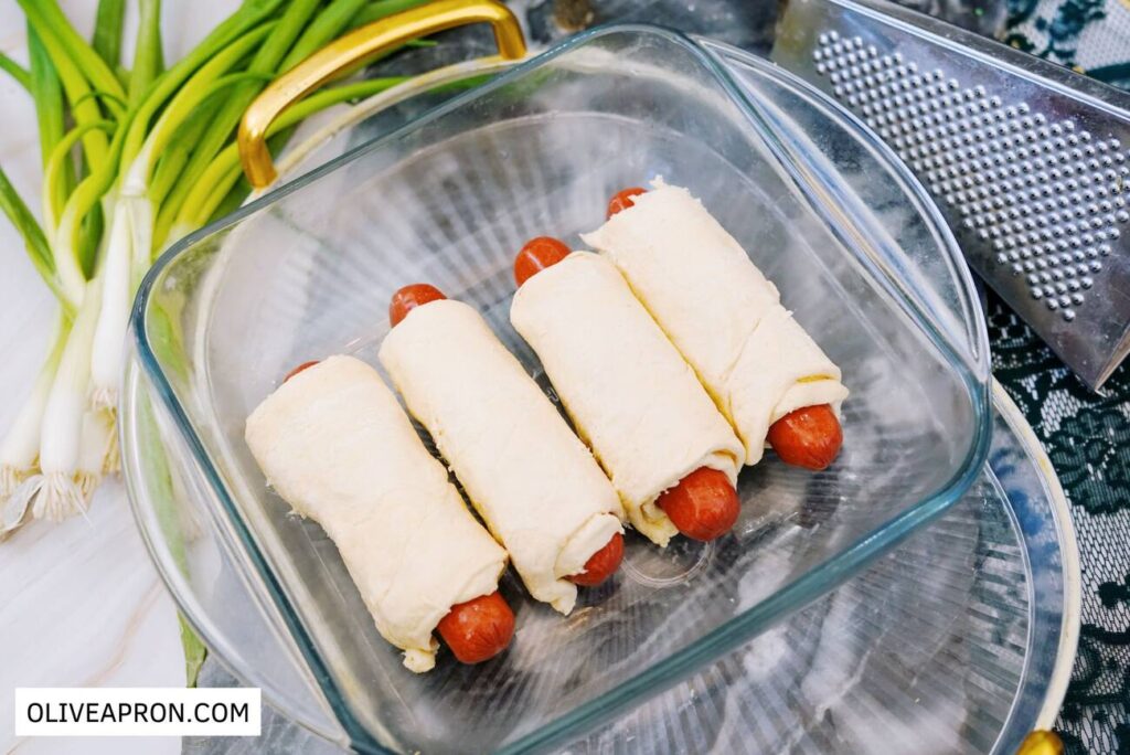 Wrapped hot dogs in cheesy crescent dough