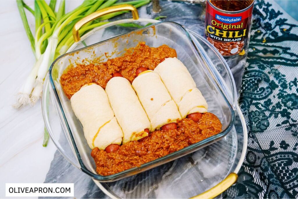 Arranged wrapped hot dogs with chili