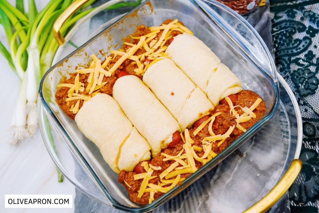 Hot dog casserole topped with shredded cheese