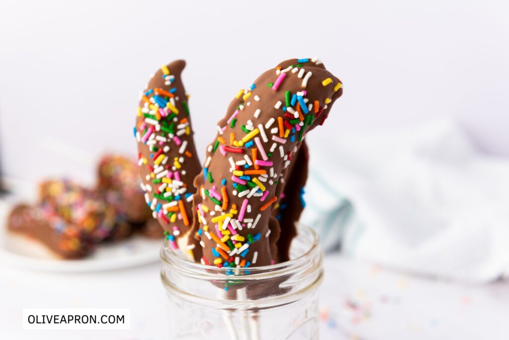 Chocolate covered bananas pops in a glass