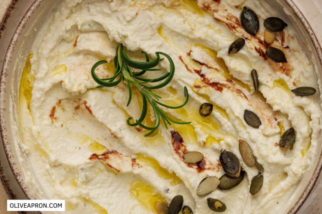 Close up of baked goat cheese dip