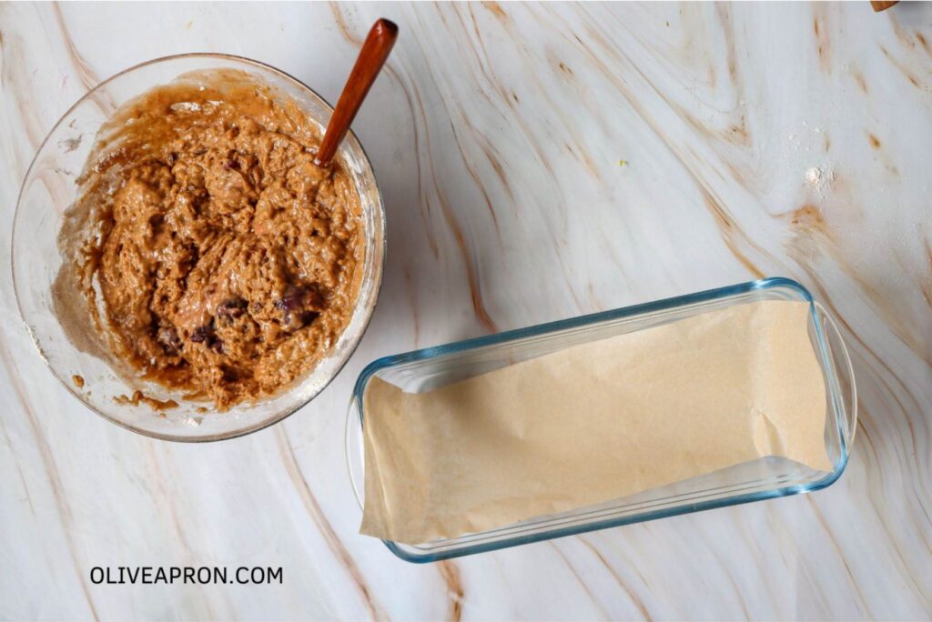 Loaf mixture in a bowl and mold with baking paper