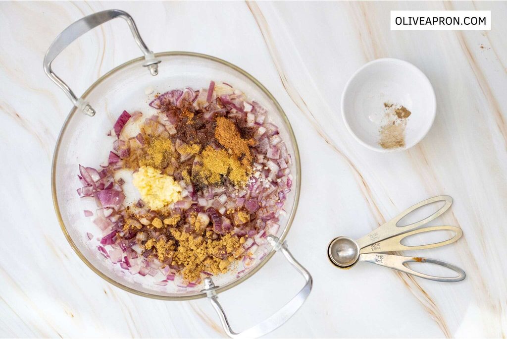 Garlic, onion, butter  and spices mixed together in a crystal bowl