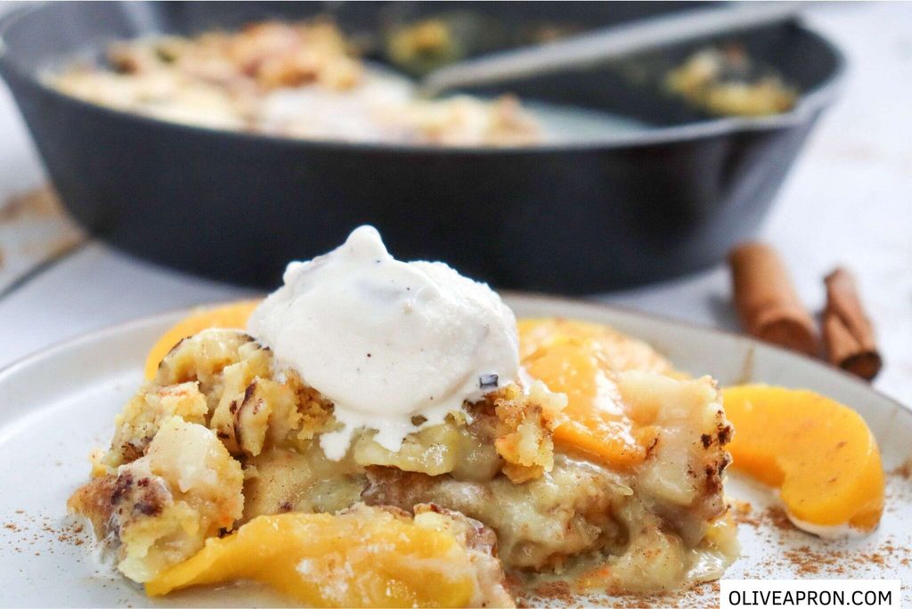 Peach dump cake portion with ice cream